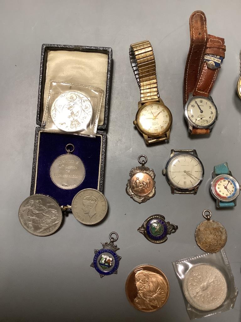 Eight assorted wrist watches including Cortebert and minor coins and medallions.